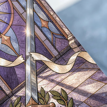 Stained glass featuring a sword, ribbons, and laurel leaves against purple and blue geometric patterns.