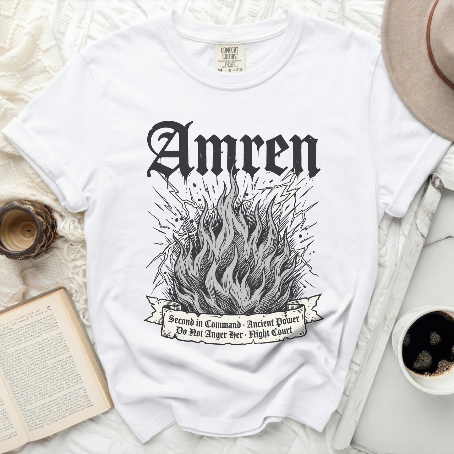 White t-shirt with graphic of flames, lightning, and text "Amren".