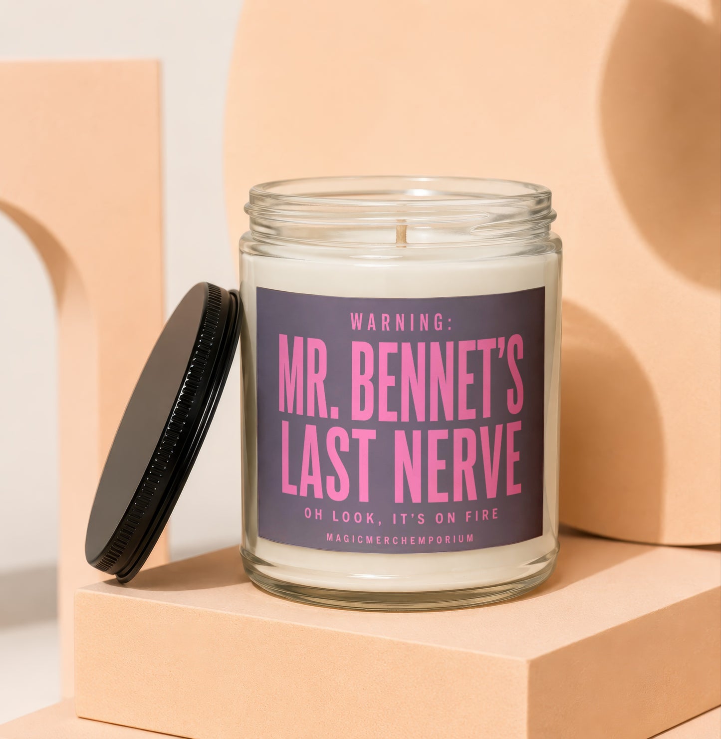 Glass candle with purple label reading "Mr. Bennet's Last Nerve".