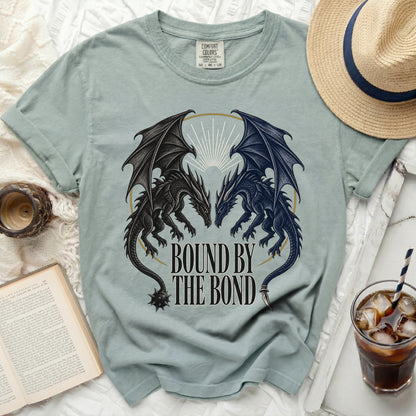 Light blue t-shirt with "Bound By The Bond" and two dragons graphic.
