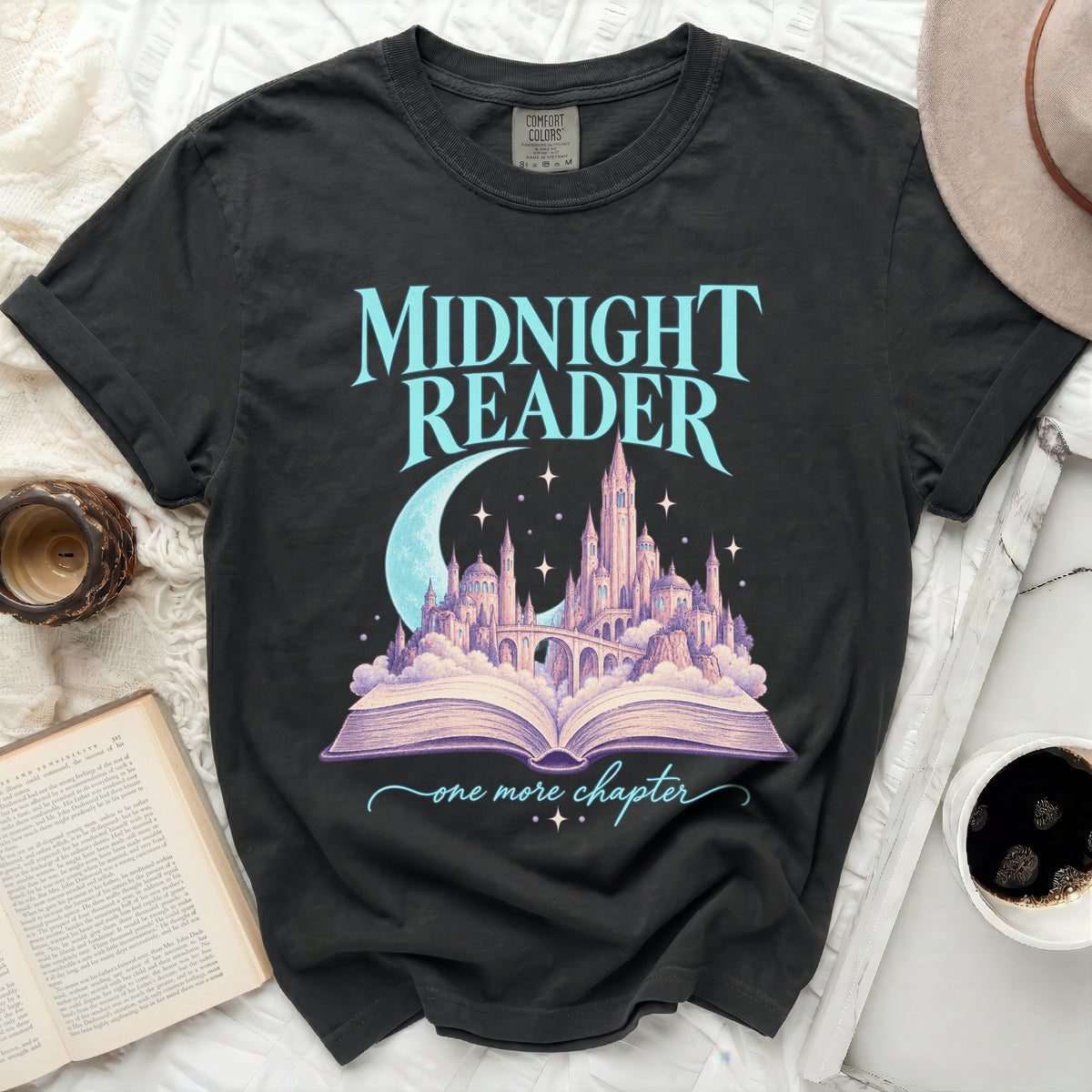 Dark t-shirt with "Midnight Reader one more chapter" graphic.