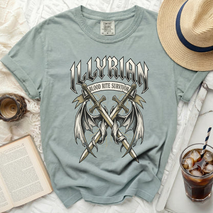 T-shirt with "ILLYRIAN BLOOD RITE SURVIVOR" and crossed swords with wings.