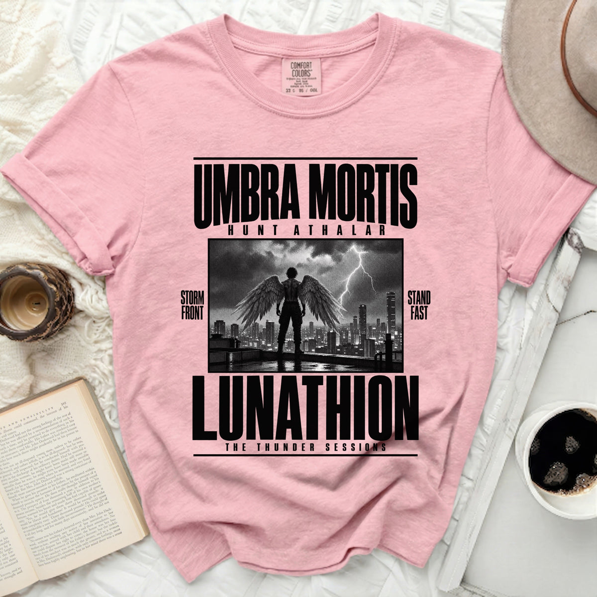 Pink t-shirt with "Umbra Mortis Hunt Athalar Lunathion" text and winged figure.