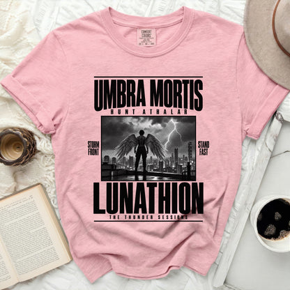 Pink t-shirt with "Umbra Mortis Hunt Athalar Lunathion" text and winged figure.