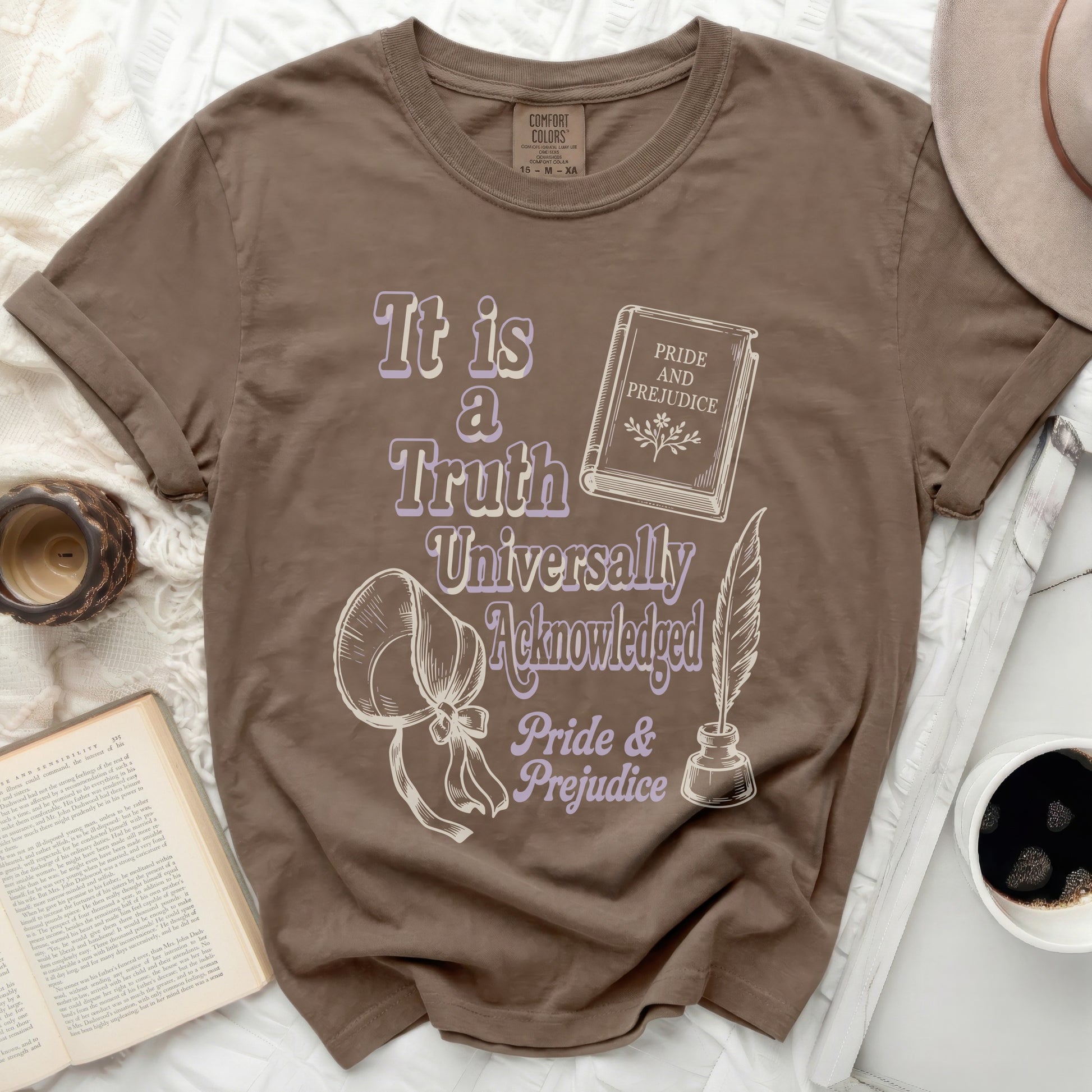 Brown t-shirt with Pride and Prejudice quote and illustrations.