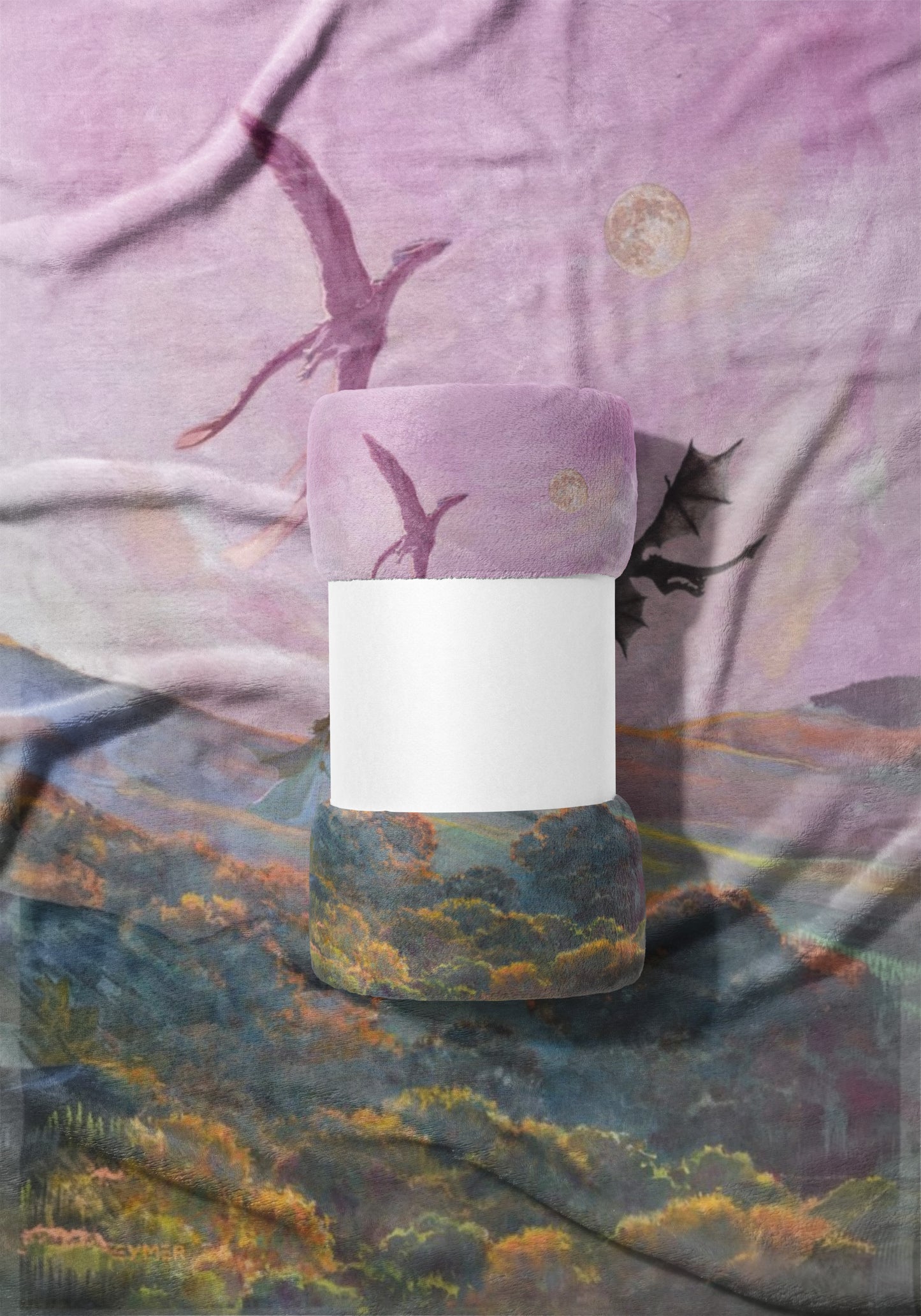 Rolled blanket with flying dragons and moon pattern on purple and landscape background.