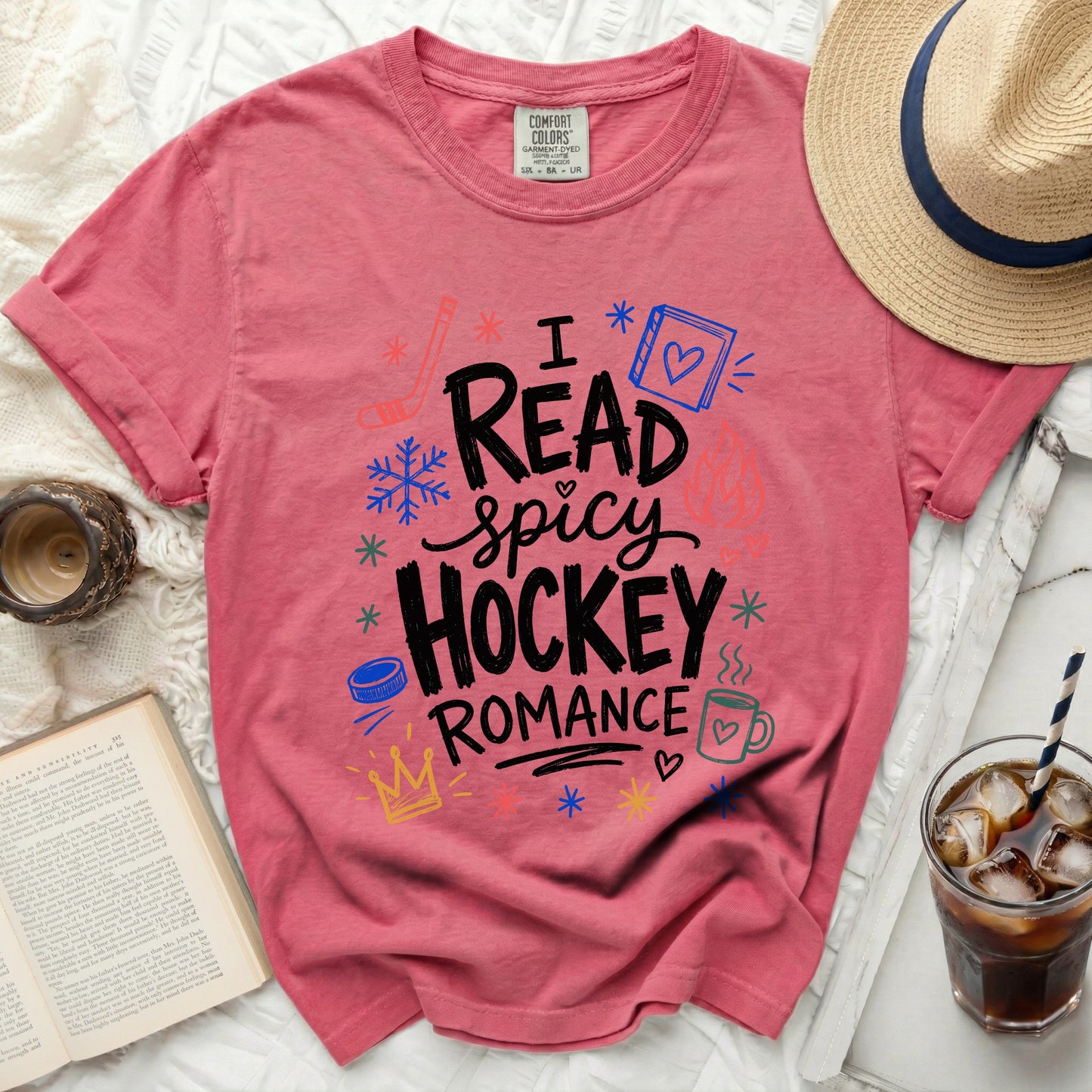 Pink t-shirt with "I Read Spicy Hockey Romance" text and hockey graphics.