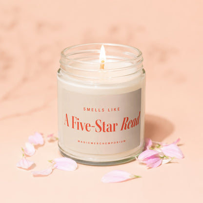 Candle that says "Smells Like A Five-Star Read" and "MagicMerchEmporium."