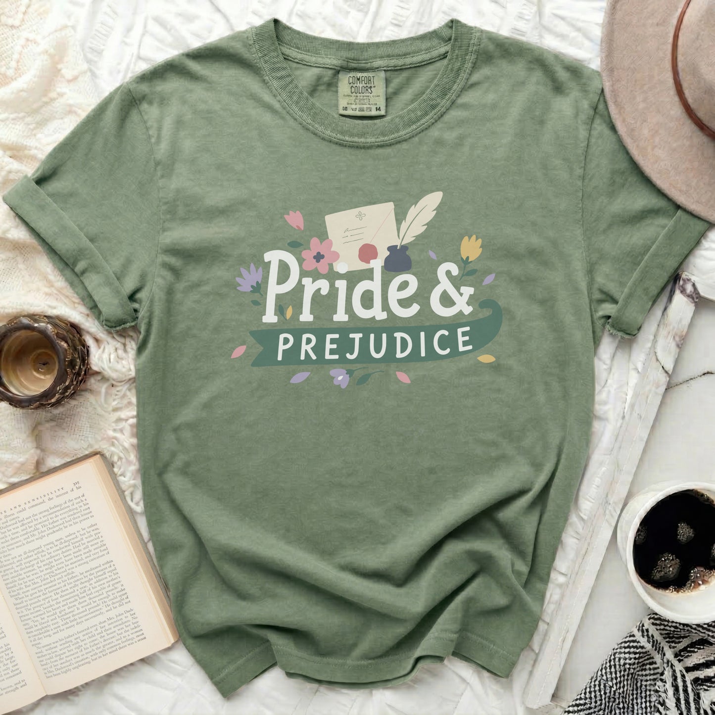 Green t-shirt with "Pride & Prejudice" text and floral accents.