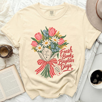 Cream t-shirt with a floral bouquet and "Fresh Books Brighter Days" text.