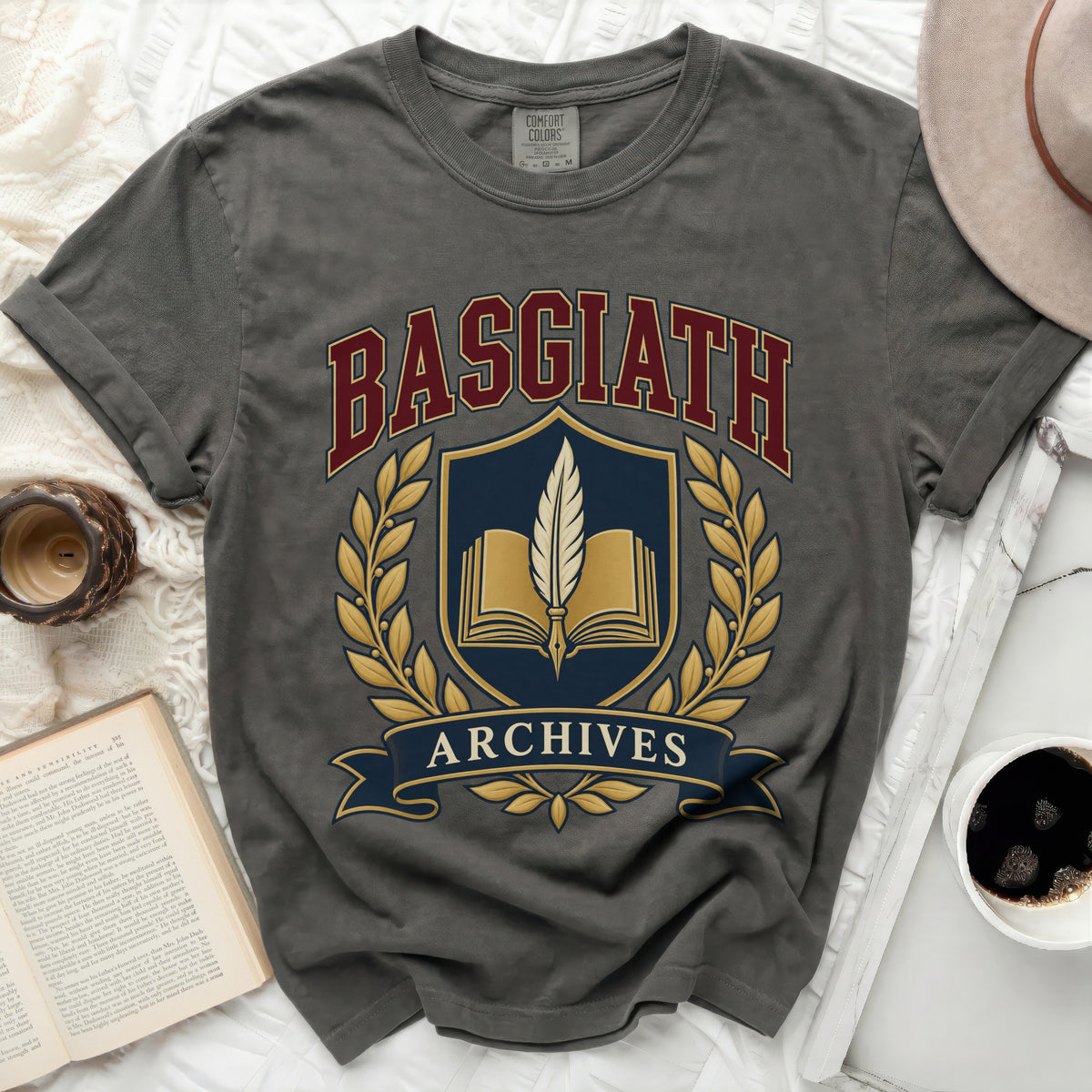 Gray t-shirt with Basgiath Archives crest featuring an open book and quill.