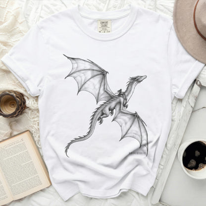 White Comfort Colors t-shirt with a black and white drawing of a winged dragon.