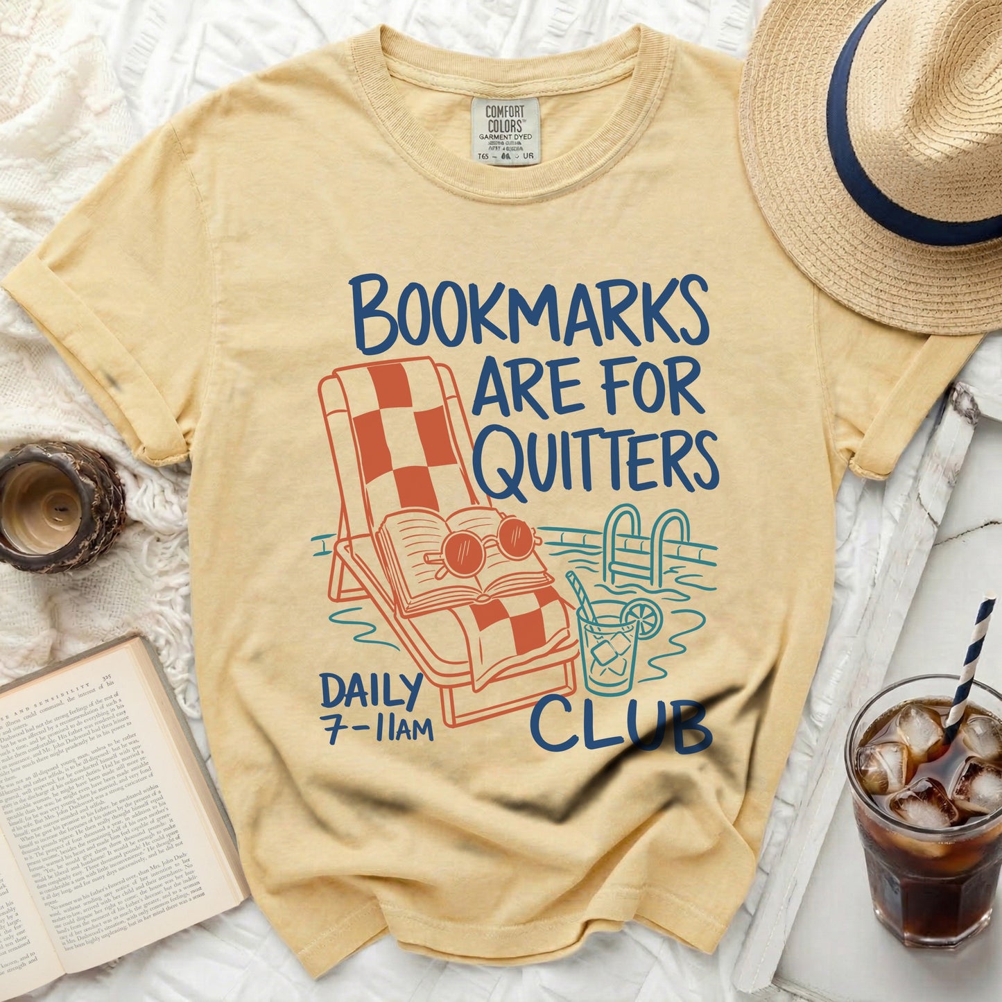 Yellow t-shirt with "Bookmarks are for quitters" text and pool graphic.