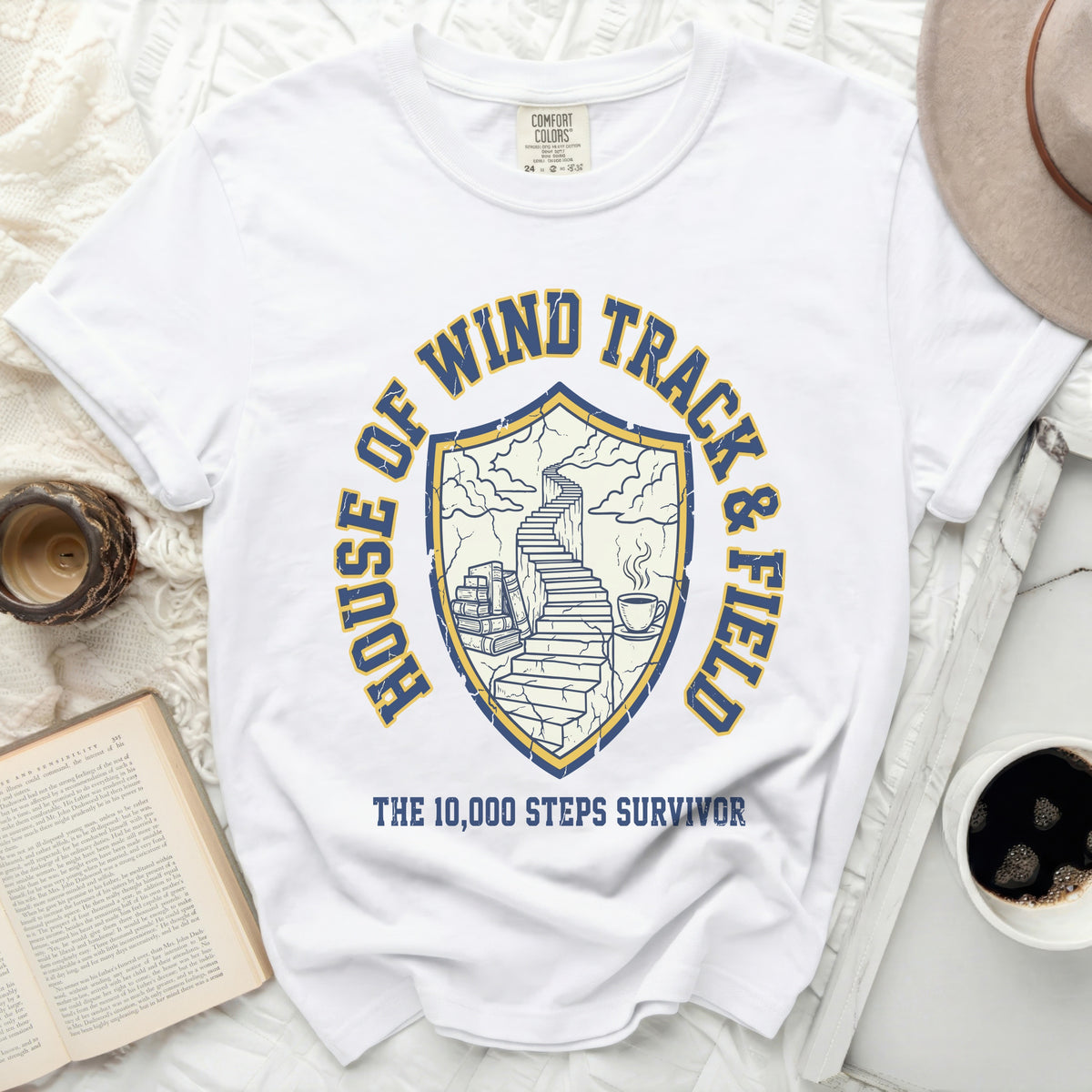 White t-shirt with "House of Wind Track & Field" and "The 10,000 Steps Survivor" graphic.