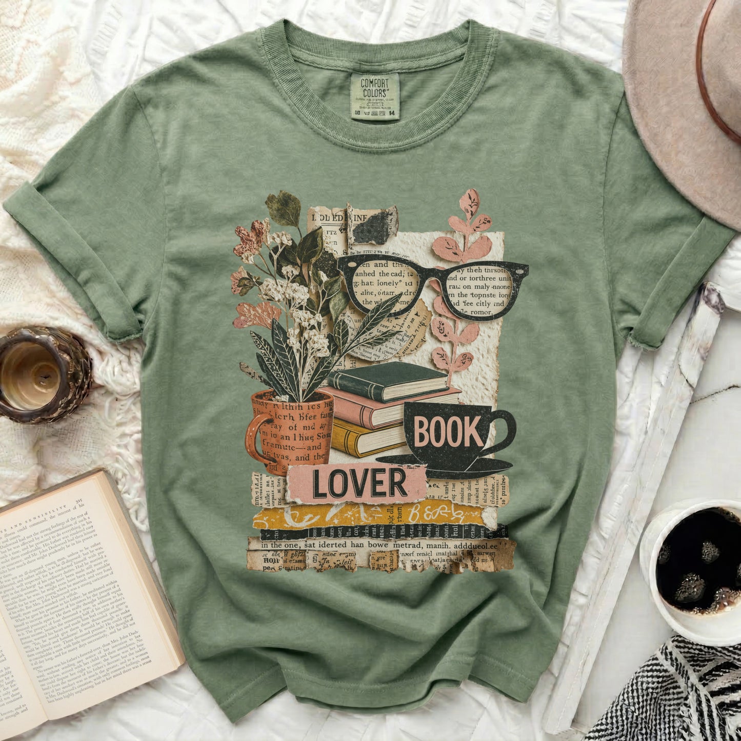 Green t-shirt with "lover" and "book" stacked on books and flowers.