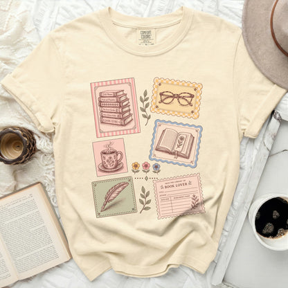 T-shirt with vintage book illustrations and library card graphic.