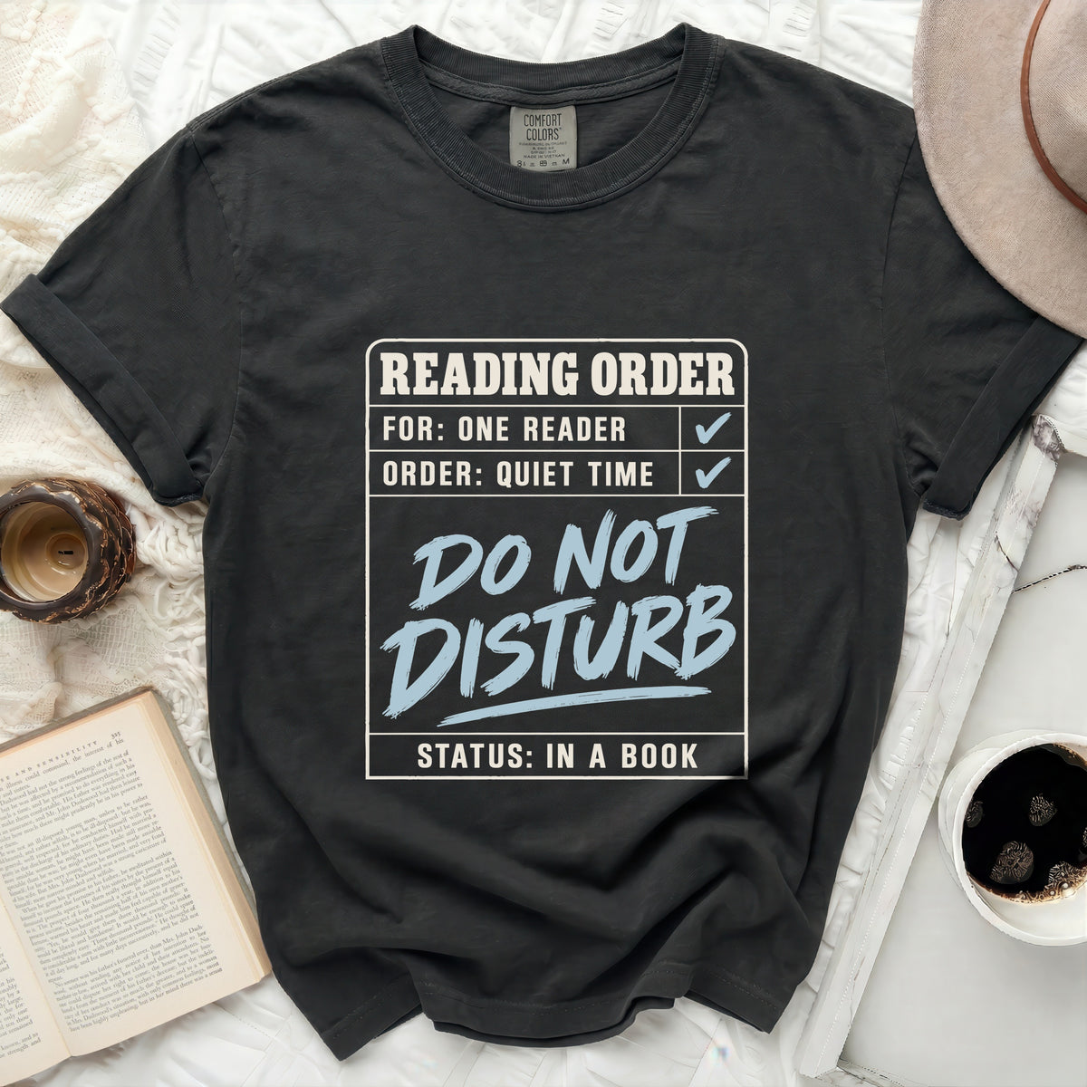 T-shirt with "Reading Order: For: One Reader, Order: Quiet Time, Do Not Disturb, Status: In a Book" graphic.