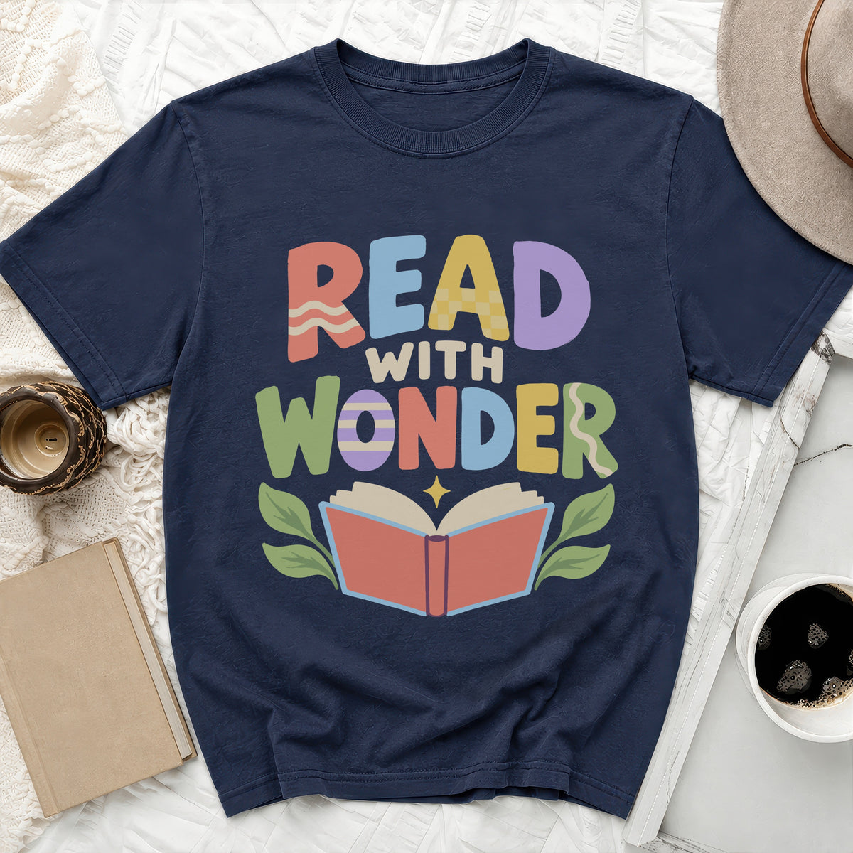Navy t-shirt with "Read With Wonder" text and an open book graphic.