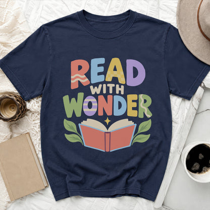 Navy t-shirt with "Read With Wonder" text and an open book graphic.