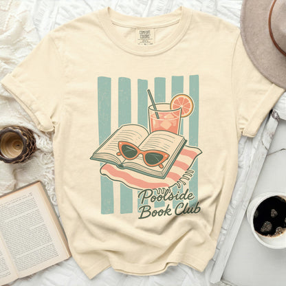 T-shirt with "Poolside Book Club" graphic of open book, sunglasses, and drink.