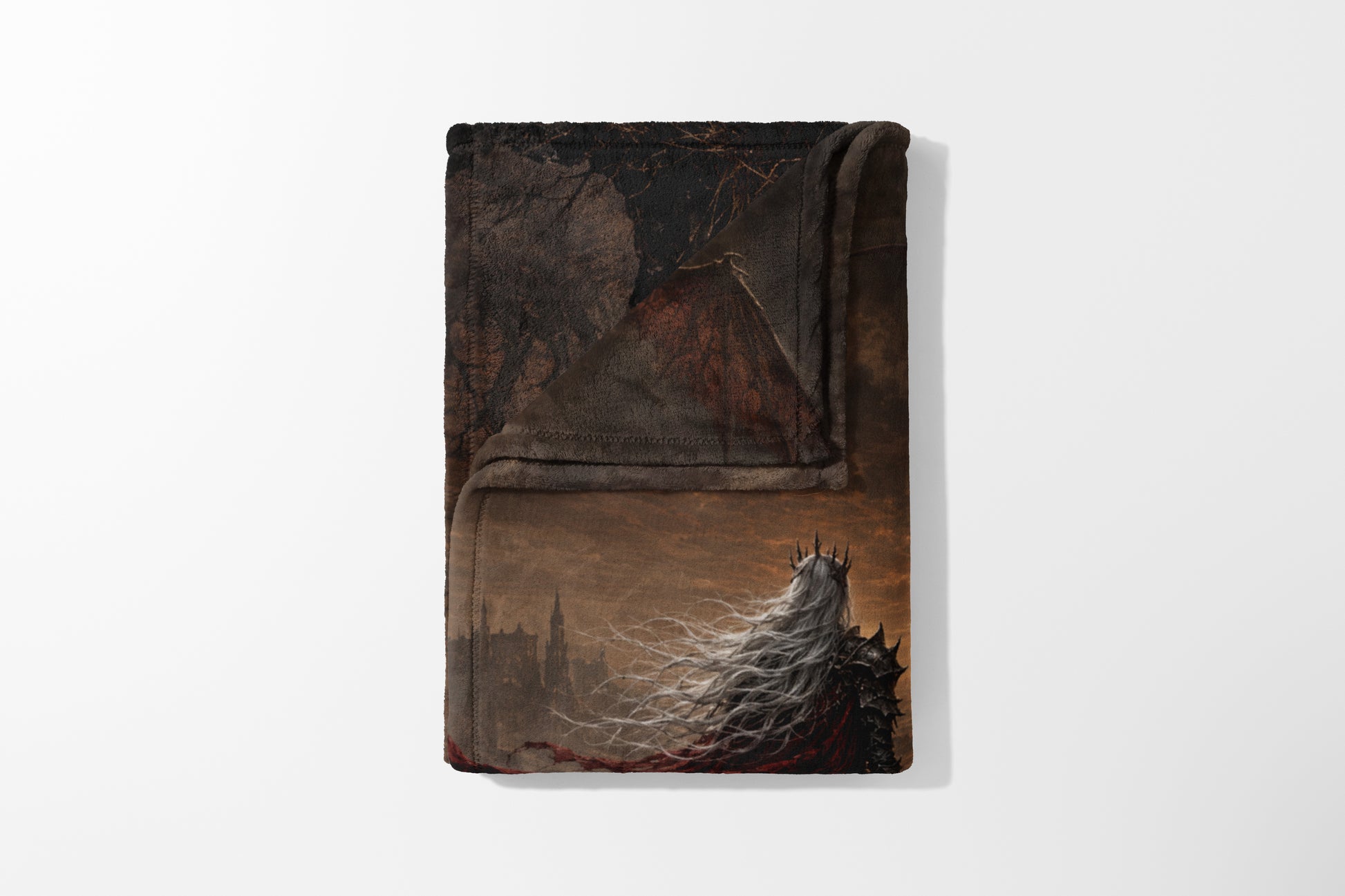 Blanket featuring a crowned figure with long white hair and dark armor facing a castle.
