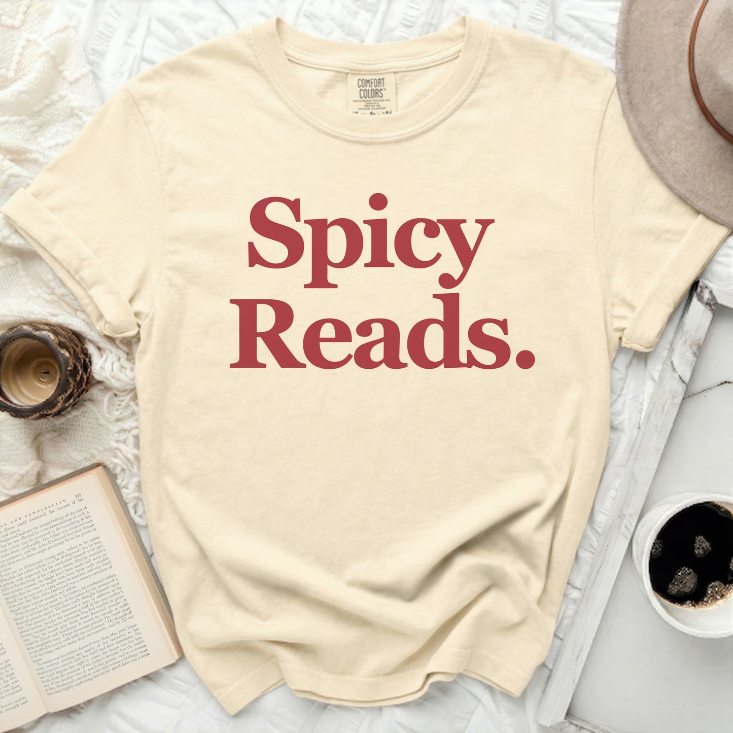 Cream t-shirt with "Spicy Reads." text in red.