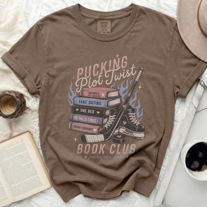 Brown t-shirt with "Pucking Plot Twist" book club design and romance tropes.