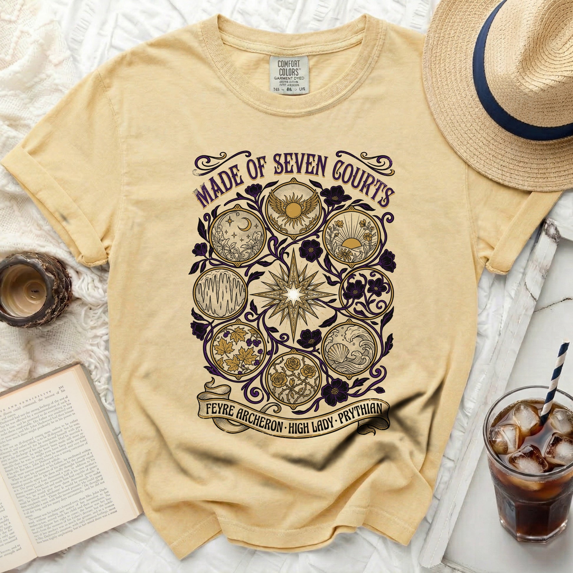 Yellow t-shirt with "Made of Seven Courts" and intricate circular designs.