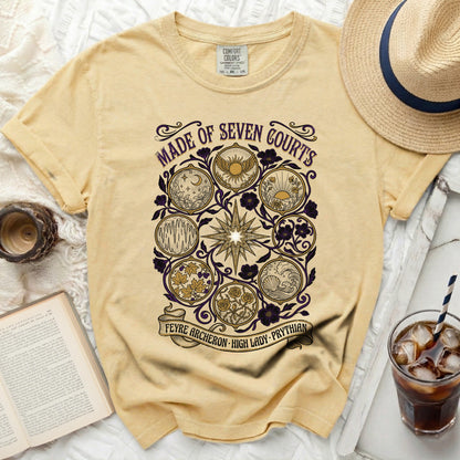 Yellow t-shirt with "Made of Seven Courts" and intricate circular designs.