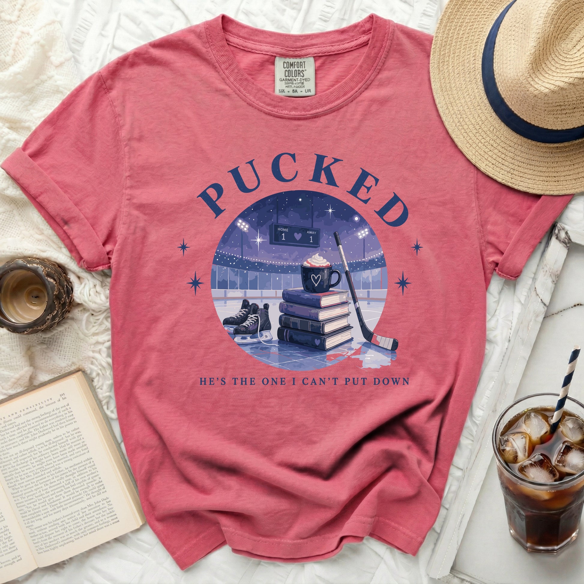 T-shirt with "Pucked" and hockey rink design, "He's the one I can't put down."