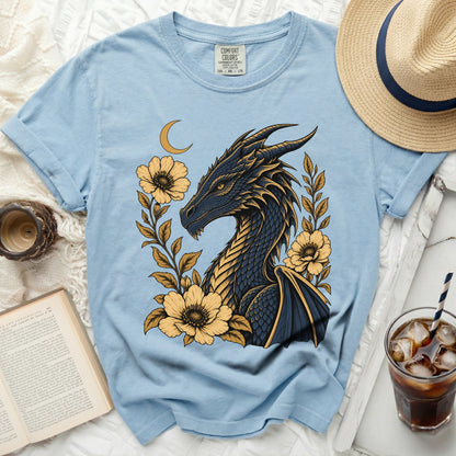 Light blue t-shirt with dark dragon and yellow flowers graphic.