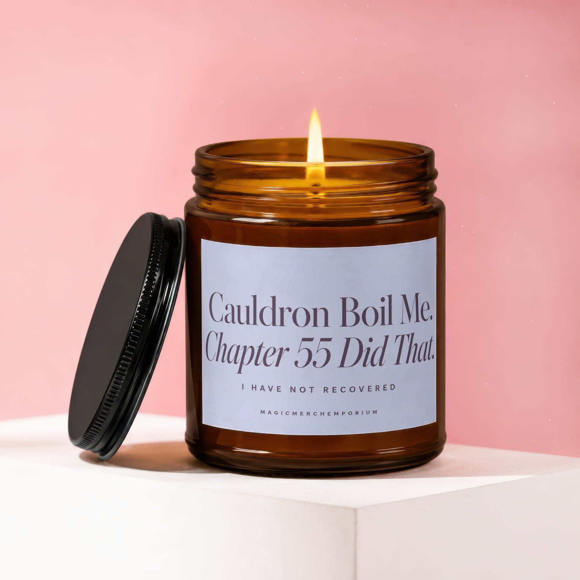Amber candle burning with label "Cauldron Boil Me. Chapter 55 Did That."