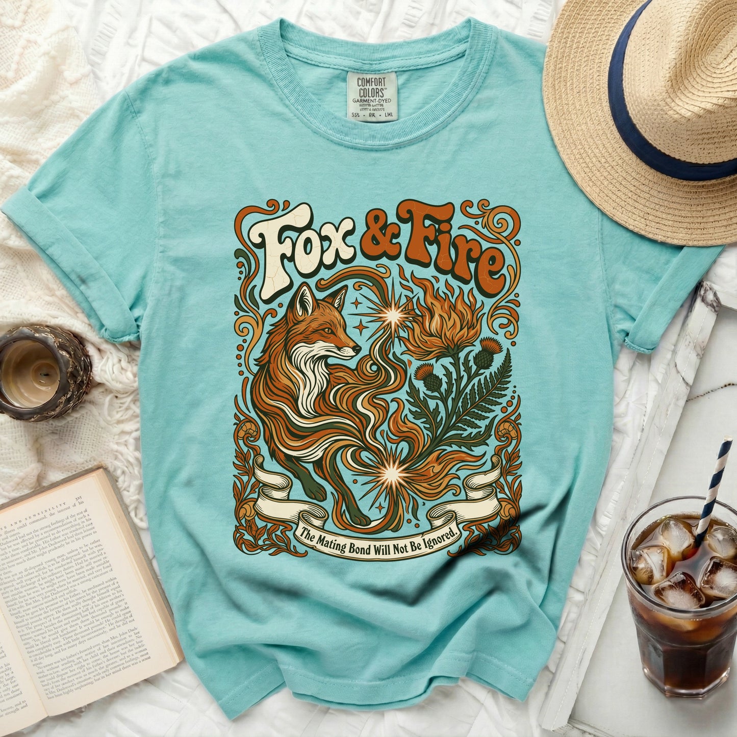 Teal t-shirt with "Fox & Fire" graphic and banner saying "The Mating Bond Will Not Be Ignored."