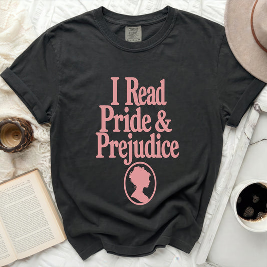 Dark grey t-shirt with pink text "I Read Pride & Prejudice" and silhouette.