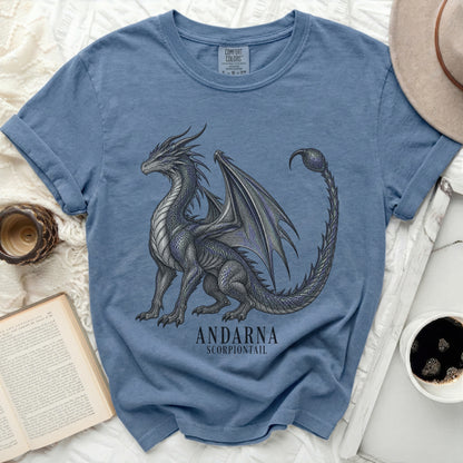 Blue t-shirt with a detailed dragon graphic and text "ANDARNA SCORPIONTAIL."