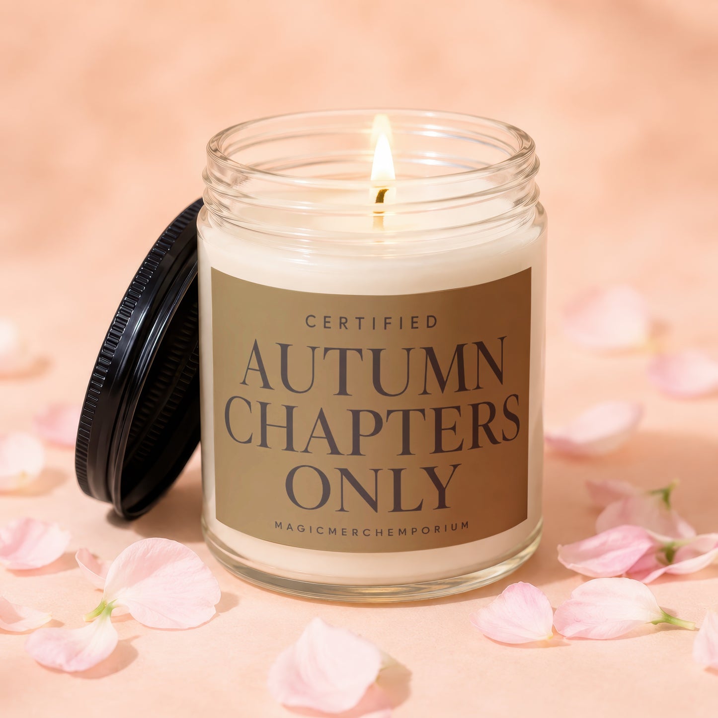 Lit glass candle with lid off, reads "Certified Autumn Chapters Only".