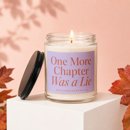 Lit candle in a jar with label that reads "One More Chapter Was a Lie" from MagicMerchEmporium.