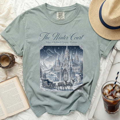 Green t-shirt with "The Winter Court" graphic featuring a castle, sleigh, reindeer, and bear.