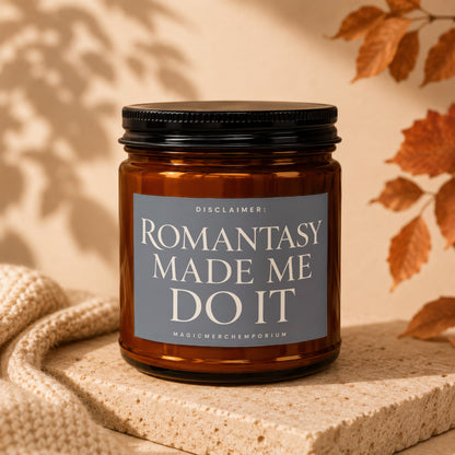 Amber jar candle with "ROMANTASY MADE ME DO IT" text on the label.