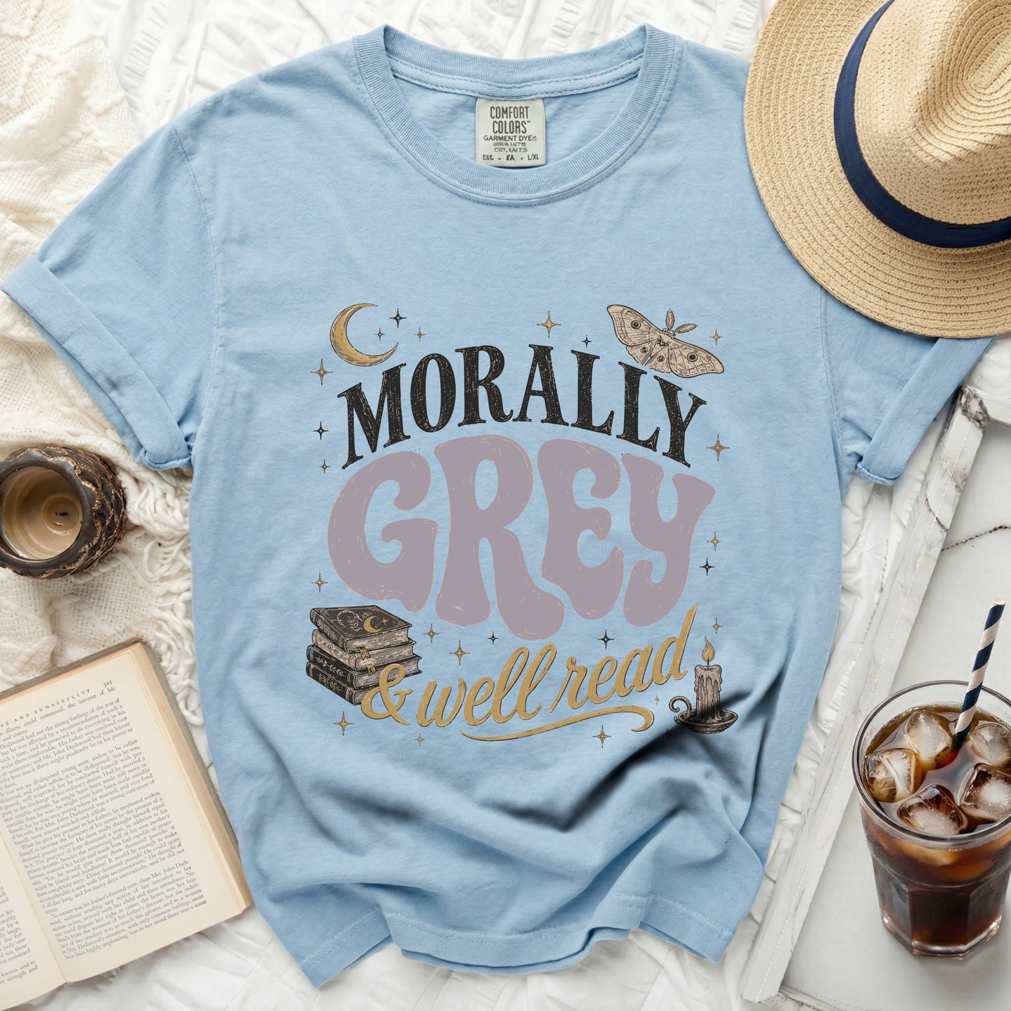 Light blue T-shirt with "Morally Grey & Well Read" graphic.