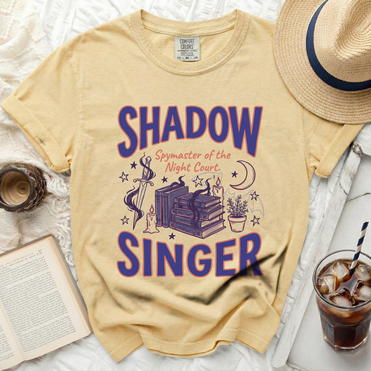 Yellow t-shirt with "Shadow Spymaster of the Night Court Singer" text and graphics.