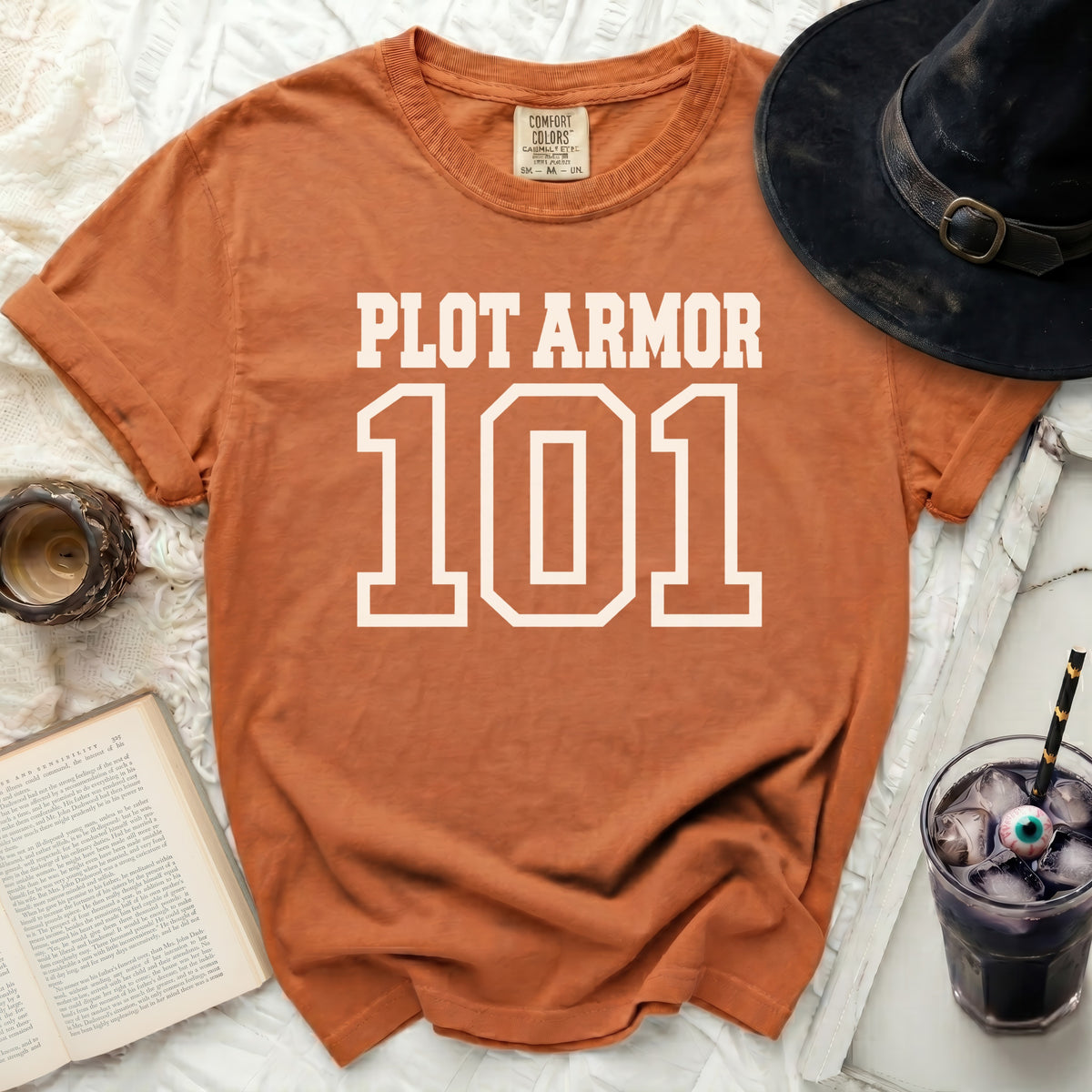 Orange t-shirt with "PLOT ARMOR 101" in white text.