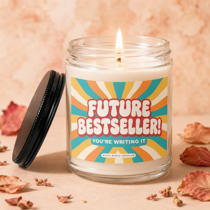 Lit candle in glass jar with "Future Bestseller! You're Writing It" label.