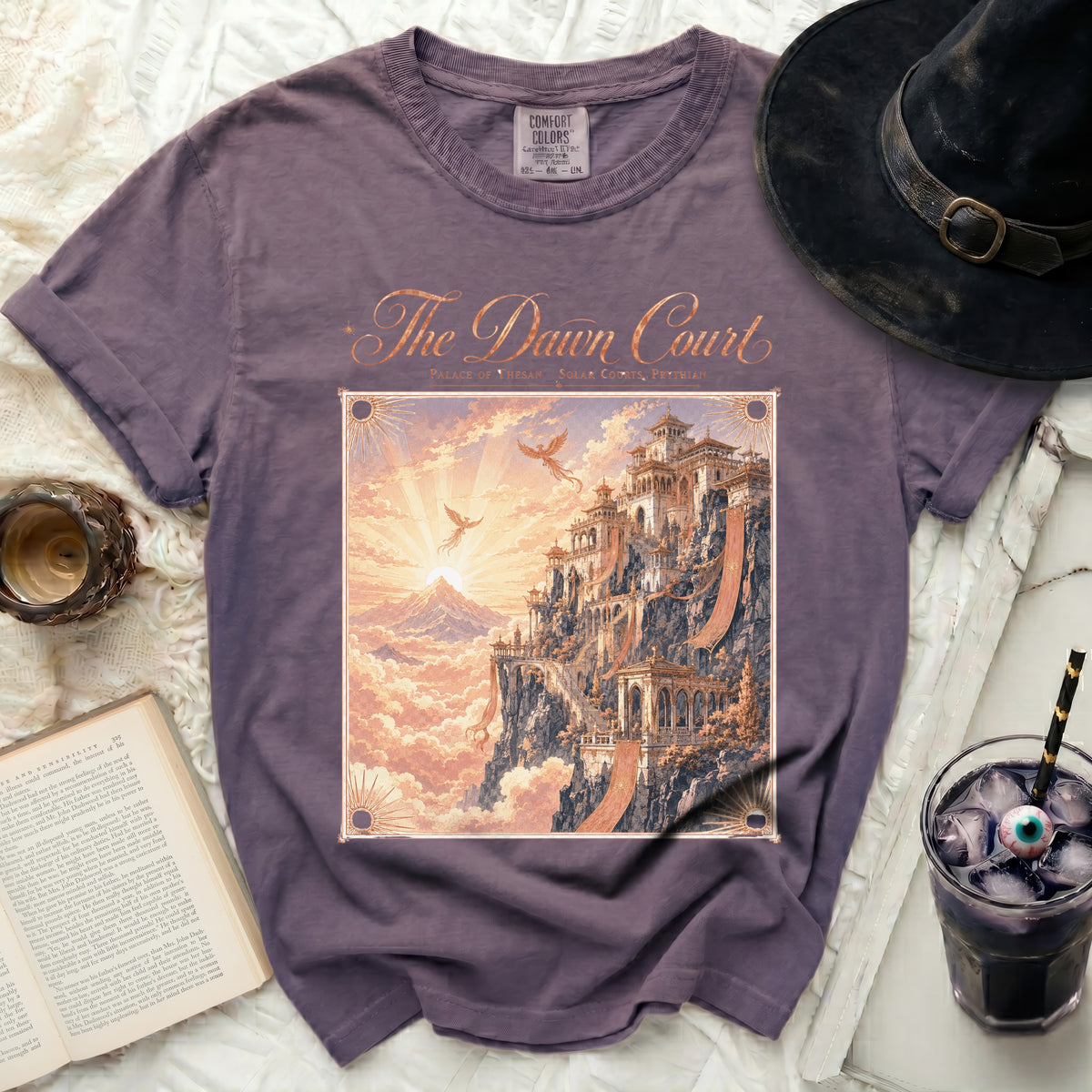 Purple t-shirt featuring "The Dawn Court" with an ornate palace and mythical birds.
