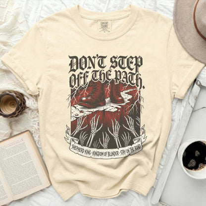 Cream t-shirt with "Don't Step Off The Path" text and graphic.