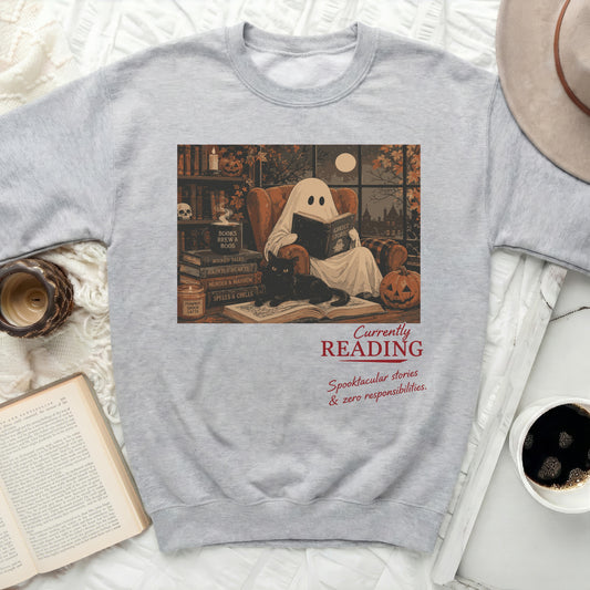 Ghost reading with cat on a shelf, text "Currently READING Spooktacular stories & zero responsibilities."