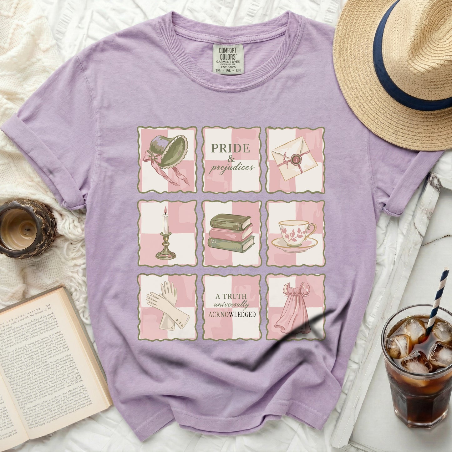 Lavender t-shirt with "Pride & Prejudices" and book-themed illustrations.