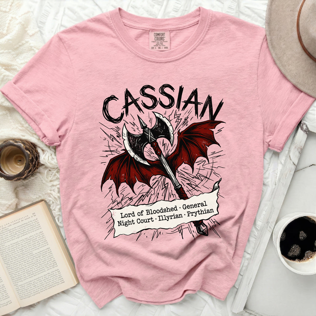 Cassian t-shirt with axe and wings graphic and descriptive text.