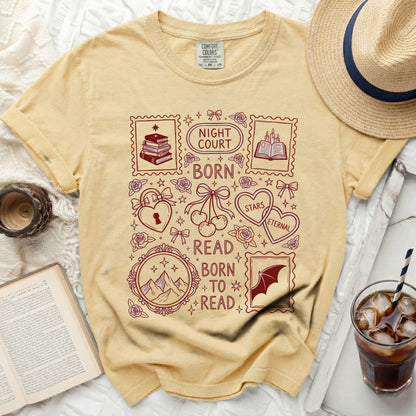 Yellow t-shirt with dark red graphic of postage stamps, books, hearts, and text.