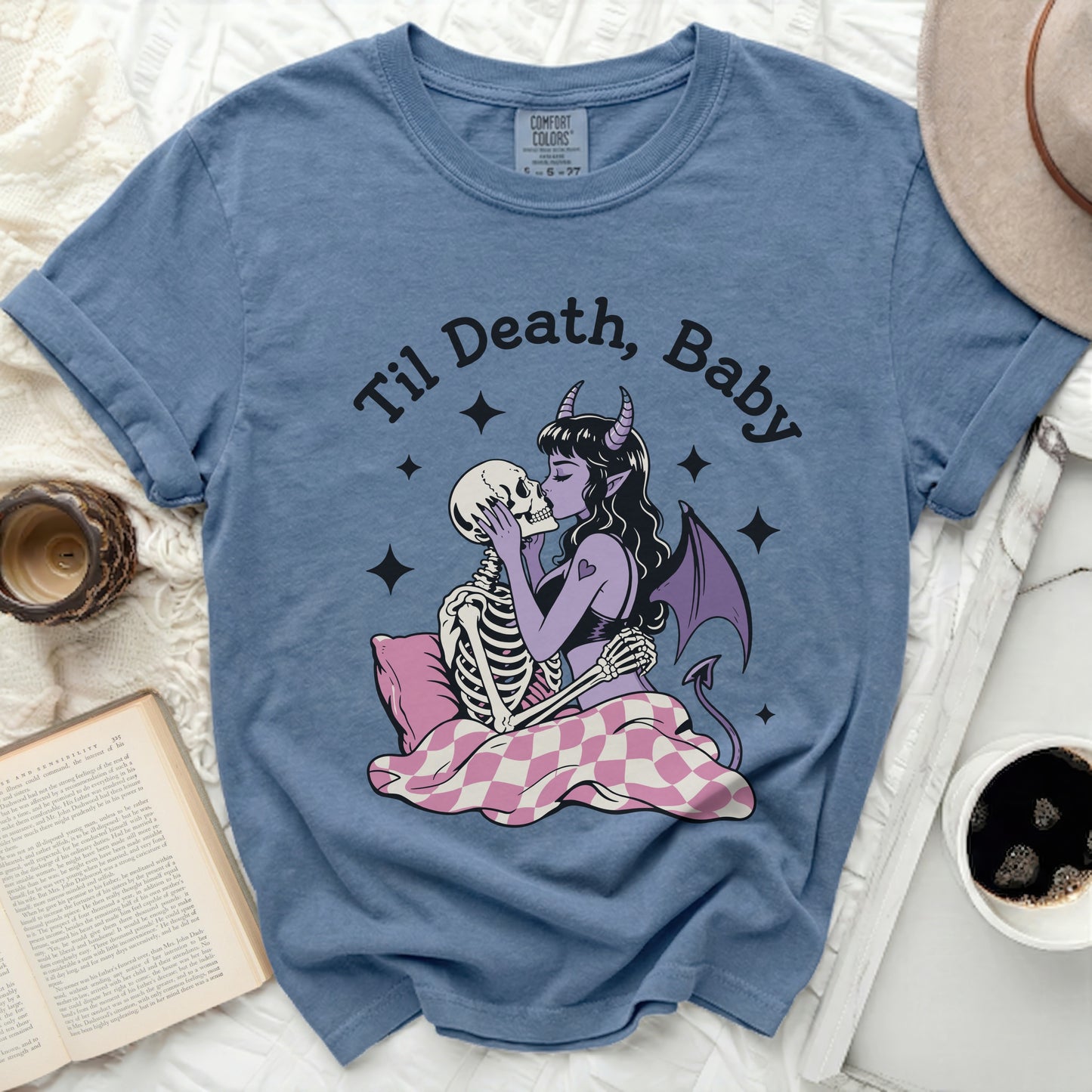 Blue t-shirt with "Til Death, Baby" graphic of a devil kissing a skeleton.